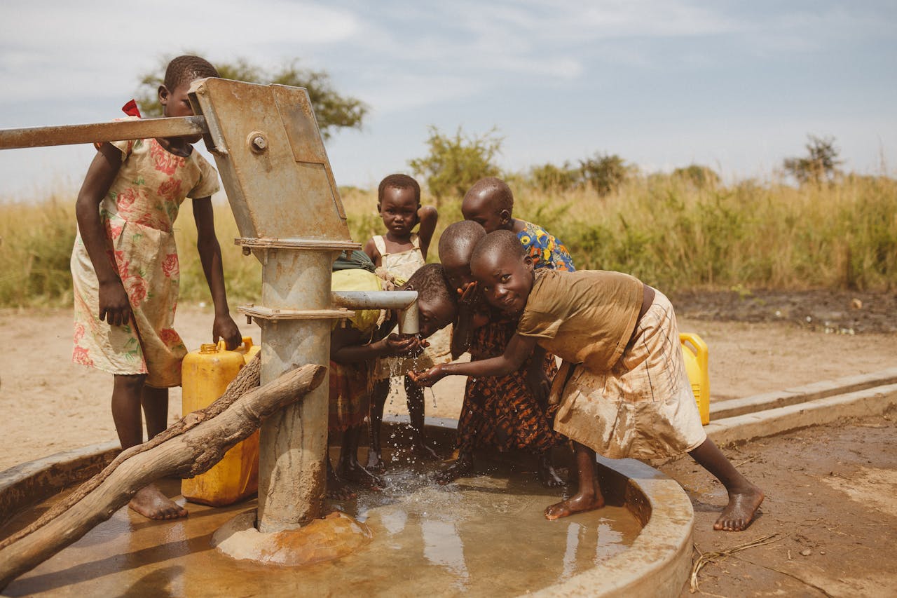 Crafting Captivating Headlines: Your awesome post title goes here Group of children gathering water from a well in Kitgum, Uganda.